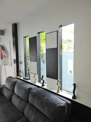 a living room with a couch and some windows at Beautiful New 3 Bed 3 Bathroom Villa 400m to Bang Tao Beach Sleeps 9 in Ban Thalat Choeng Thale