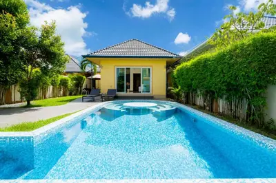 a swimming pool in the backyard of a villa at Mediteranean style 3 BR Pool Villa Platinum with garden in Rawai Beach