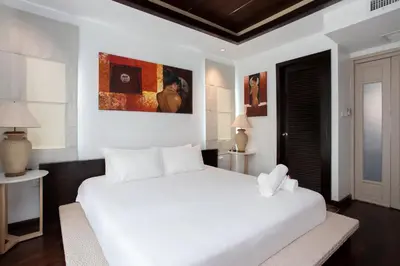 a white bedroom with a large white bed in it at 5 BR Villa Kalim 5 Private Pool with Seaview in Patong Beach