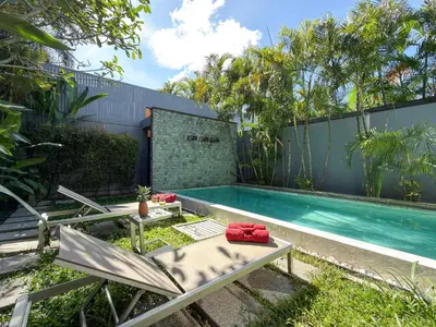 a swimming pool in the backyard of a house at Villa 2BD Nai Harn Beach by Mill in Ban Saiyuan (1)