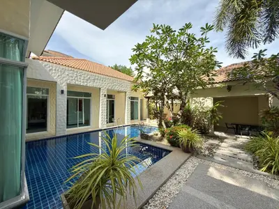 a swimming pool in the backyard of a house at Nai Harn Family Pool Villa 4 bdr in Ban Saiyuan (1)