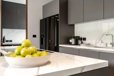 a kitchen with a bowl of fruit on a counter at Grand View Lagoon - private paradise in Phuket in Ban Thalat Choeng Thale