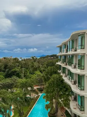 a view of a resort with a pool and palm trees at Large Lux Studio in La Vita 5-star Rawai in Rawai Beach