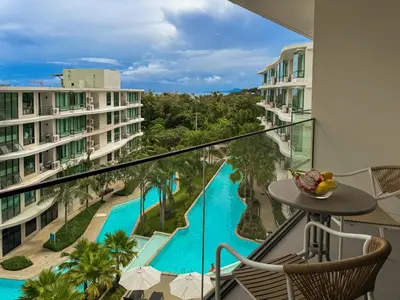 a balcony with a view of a pool at Large Lux Studio in La Vita 5-star Rawai in Rawai Beach