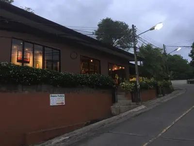 a building with a sign on the side of a street at Karon Chic Seashore Apartment in Karon Beach