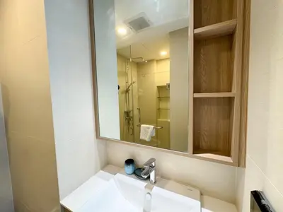 a bathroom with a sink and a mirror at Laguna Skypark 1BR Apartment garden view NEW in Laguna Phuket
