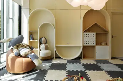 a living room with a couch and a room with archways at Title Legendary, 1-BR, 45 sqm, 8 min to BangTao Beach in Bang Tao Beach