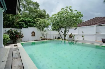 a swimming pool in the backyard of a house at Number Nine Pool Villa in Ban Tha Rua