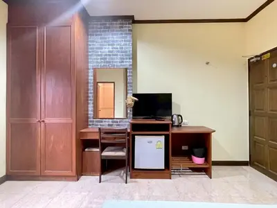 an office with a desk with a computer and a mirror at Maap Guest House in Patong Beach