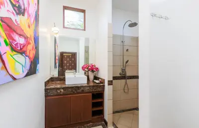 a bathroom with a sink and a mirror at 6 Bedroom Villa Sri Suri with Private Pool and Butler service near Nai Harn Beach in Rawai Beach