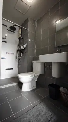 a bathroom with a toilet and a sink at D Condo mine Kathu in Kathu