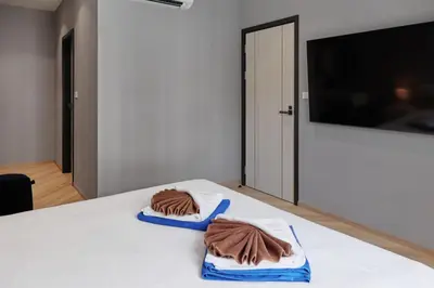 two towels sitting on top of a white table at Brand New apartments, 60 sqm, BangTao beach in Bang Tao Beach
