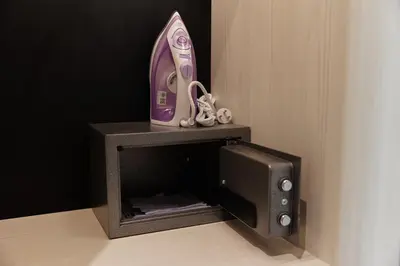 a small safe with a phone and a tv at Brand New apartments, 60 sqm, BangTao beach in Bang Tao Beach
