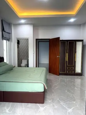 a bedroom with a bed and a wooden cabinet at Villa Sea View PanWa in Ko Taphao Noi