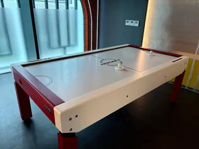 a ping pong table sitting in a room at The Legendary Apartment 408 in Bang Tao Beach