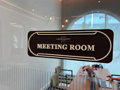 a sign for a meeting room in a restaurant at The Legendary Apartment 209 in Bang Tao Beach