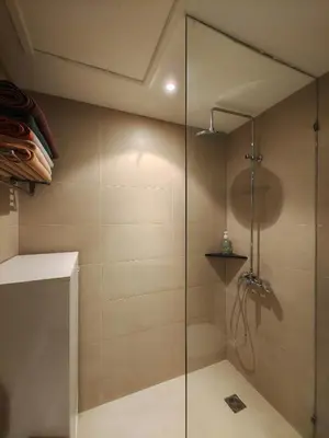 a shower with a glass door in a bathroom at Apartment 2 bedrooms in Allamanda in Laguna Phuket
