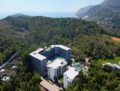 an aerial view of a building in the woods at Pool Access 1 Bedroom Duplex UTL A107 near Nai Harn Beach in Rawai Beach