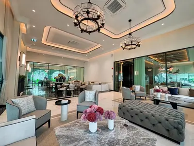 a lobby with couches and chairs and a table at Modern 1BR with Pool View The Title Legendary in Bang Tao Beach