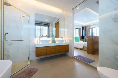 a bathroom with a tub and a sink and a shower at New Luxury Pool Villa Bangtao Phuket in Ban Pak Lak