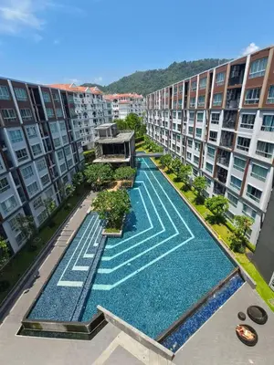 an aerial view of an apartment complex with a swimming pool at The Azure Kathu in Kathu