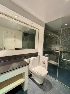 a bathroom with a toilet and a sink and a shower at Apartment with sea view 2 beds in Kamala Beach
