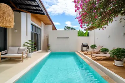 a swimming pool in the backyard of a villa at Villa Moana 2BR Private Pool Naiharn beach in Rawai Beach