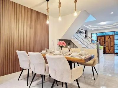 a dining room with a table and chairs at 4 bedroom Lucky House Patong in Patong Beach