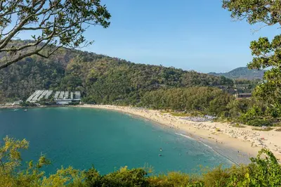 a beach with a bunch of people in the water at Holiday Villa 2-BR J10, Private Pool, Rawai Beach in Phuket Town