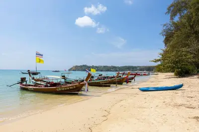 a group of boats sitting on the beach at Holiday Villa 2-BR J10, Private Pool, Rawai Beach in Phuket Town
