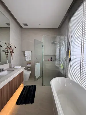 a bathroom with a tub and a sink and a shower at Phuket Moana Pool Villa in Ban Na Nai