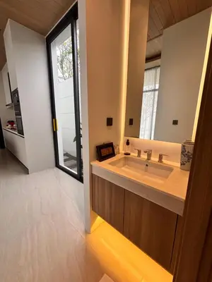 a bathroom with a large sink and a large window at Phuket Moana Pool Villa in Ban Na Nai