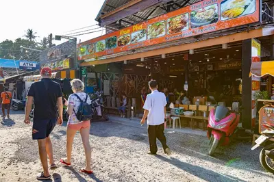 a group of people walking in front of a store at Tropical villa Sweet Dreams R20, Private Pool, Rawai Beach in Phuket Town