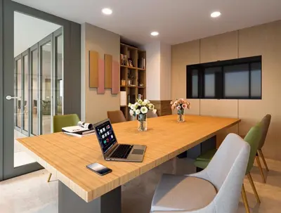 a dining room with a table with a laptop on it at New Condo Boat Avenue Modern Loft 325 in Ban Thalat Choeng Thale