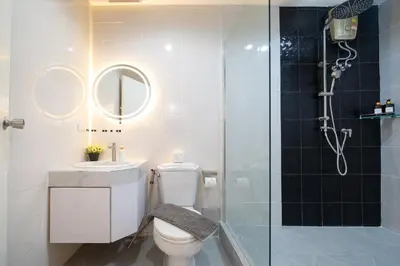 a bathroom with a shower and a toilet and a sink at 3BR pool at Bangla Patong reach beach in 5m walk in Patong Beach