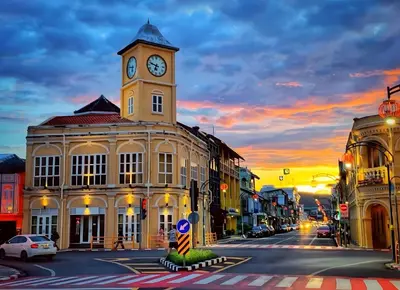 a building with a clock tower on top of it at XX Mitr Inn - ภูเก็ต เมืองเก่า Phuket Old Town 2 in Phuket Town