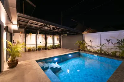 a swimming pool in the middle of a building at Luxury 3 bed villa with private pool, Rawai Phuket in Rawai Beach
