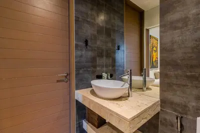 a bathroom with two sinks and a mirror at V259 Great for Relaxing with Pool & Full Amenities in Thalang