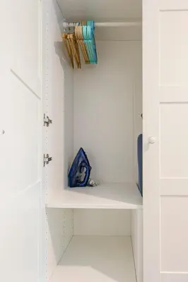 a closet with white shelves and a blue box at Cozy studio Pool View near of NaiYang beach in Nai Yang Beach