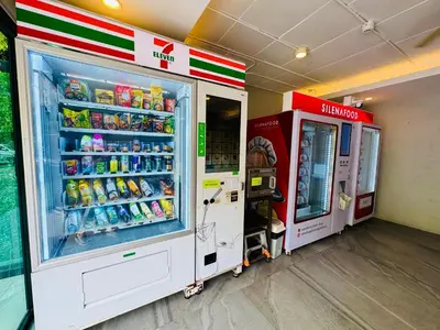 a gas station with two machines with drinks at Cozy studio Pool View near of NaiYang beach in Nai Yang Beach