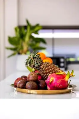 a plate of fruit sitting on a counter at Villa Mimosa 4 - Luxury 4BR Private Pool - Rawai in Kata Beach