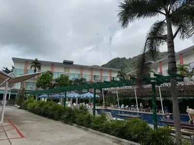 a hotel with a swimming pool and a resort at The Trend Villa in Kamala Beach