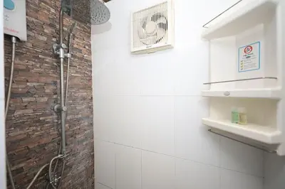a bathroom with a shower and a sink at BAN House, Bang Tao beach in Ban Thalat Choeng Thale