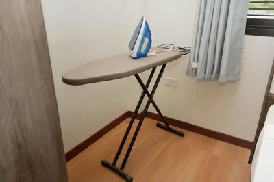 a desk with a computer on top of it in a room at 2 bedrooms house GREEN SALLY in Patong Beach