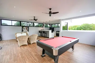 a living room with a pool table in it at Suwali Villa - 3 Bedroom Private Pool Villa in Ban Saiyuan (1)