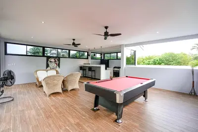a living room with a pool table in it at Suwali Villa - 3 Bedroom Private Pool Villa in Ban Saiyuan (1)