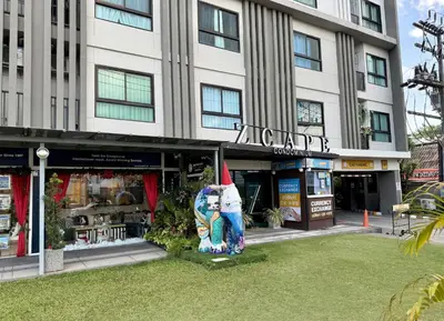 a building with a statue in front of it at Z cape 1 one one in Laguna Phuket