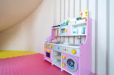 a pink play room with a pink playset at Apartments Bellevue Lagoon Phuket near Laguna in Phuket