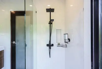 a shower in a bathroom with a glass door at 3BR Pool Villa with Jacuzzi near Patong - 8 Guests in Kathu
