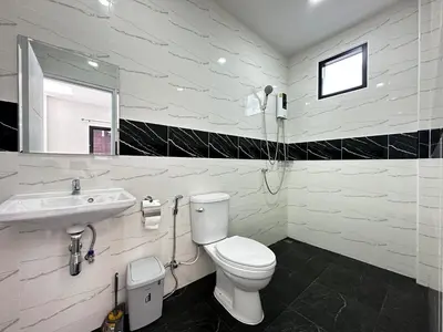a bathroom with a white toilet and a sink at Layla house, Bang Tao beach in Ban Thalat Choeng Thale